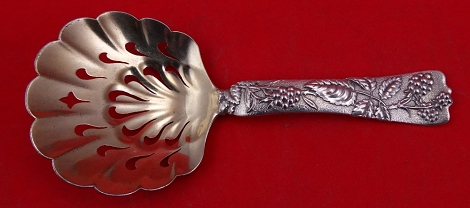 Bon Bon Spoon GW pierced w/ swirls  w/ raspberry motif  5 1/8